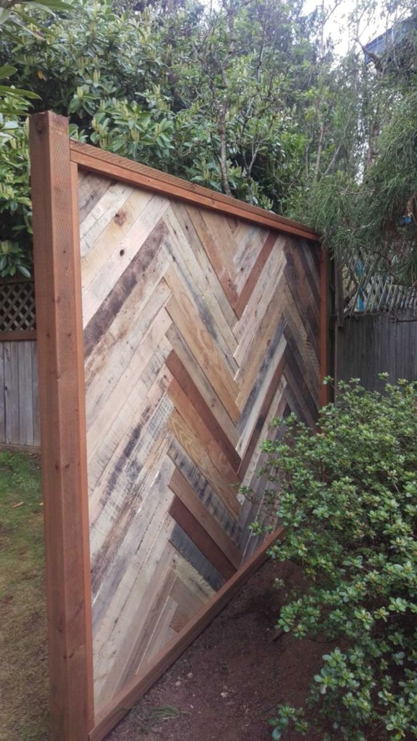 Backyard fence made with repurposed pallets