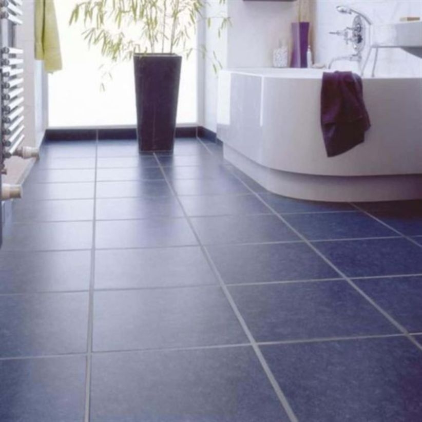 Bathroom with navy floor tiles