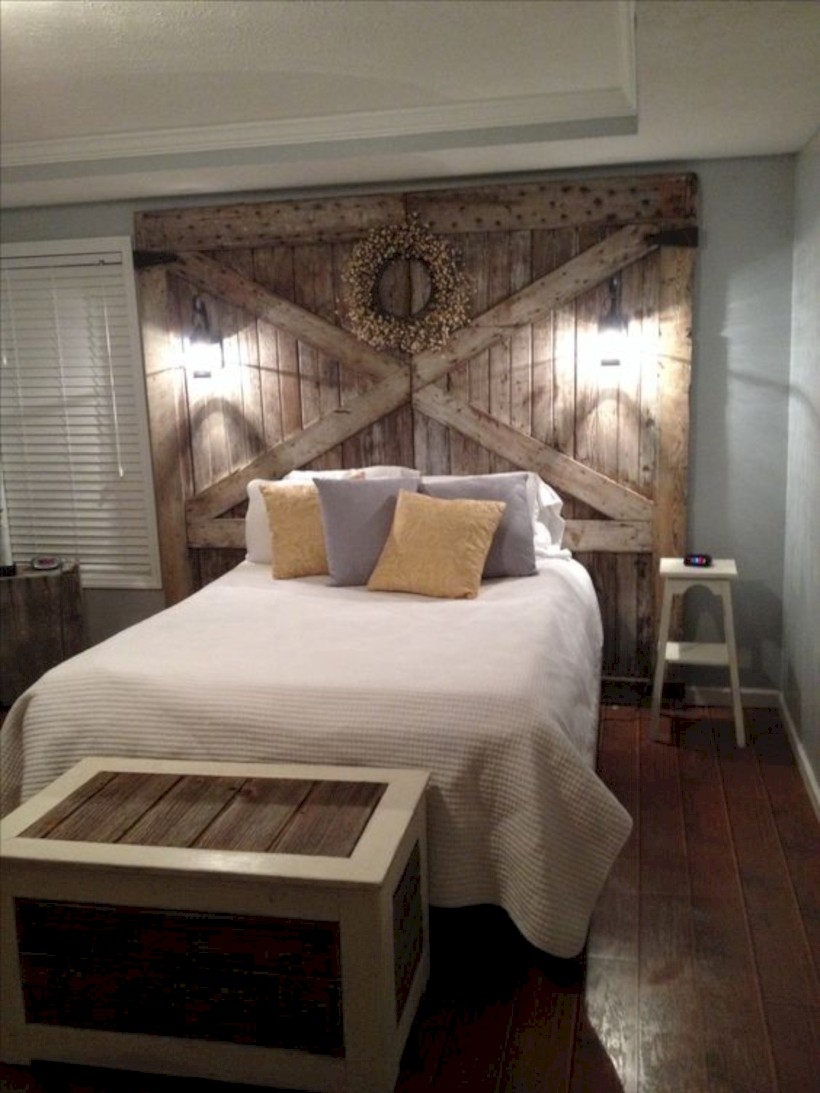 Bedroom with barn wood headboard and lights