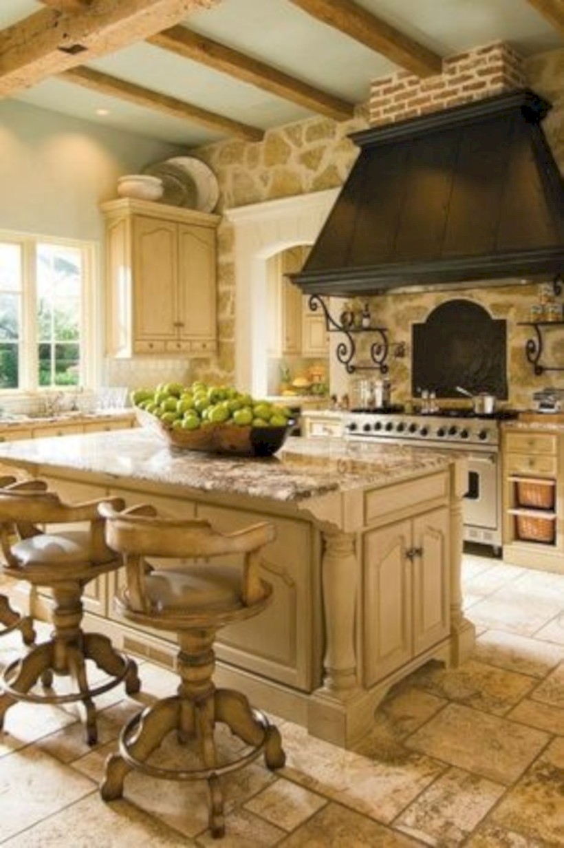 Kitchen with granite countertops and travertine floor