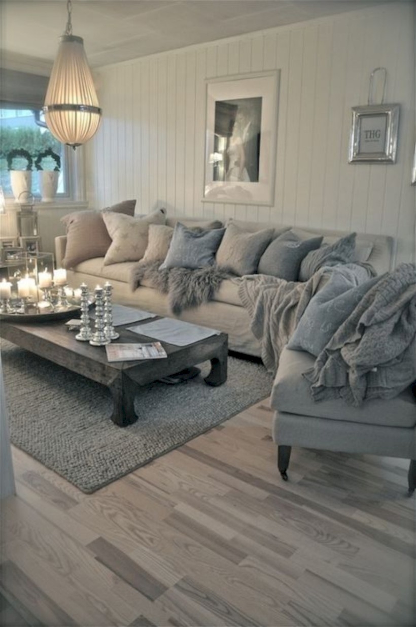 Neutral sectional sofa and rustic wood coffee table in the living room