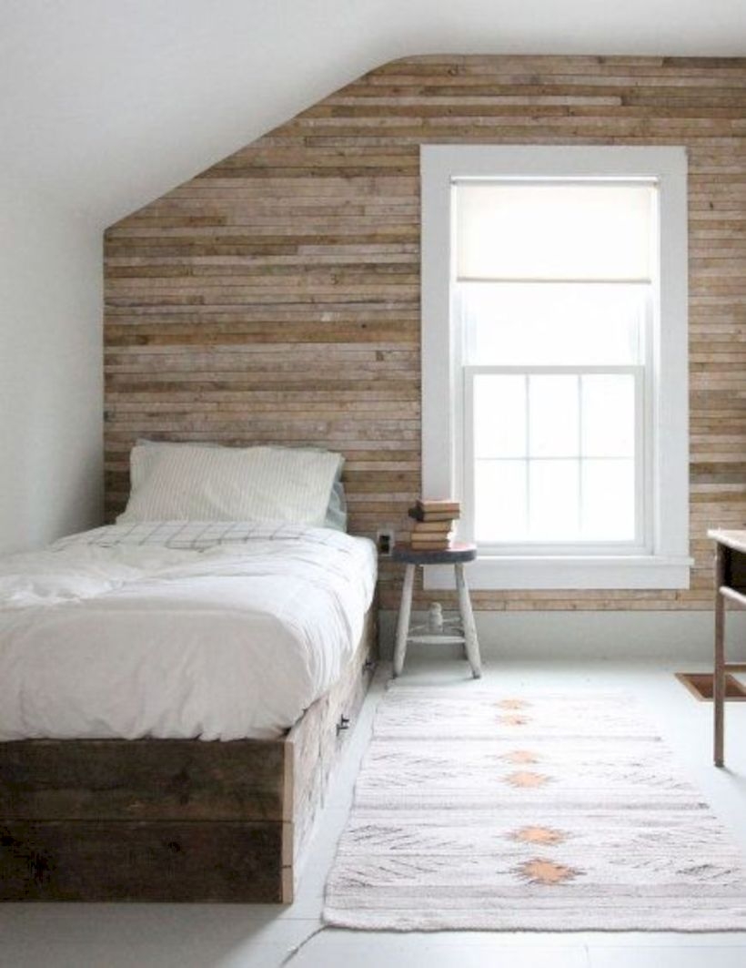 Attic bedroom with horizontal wood plank wall