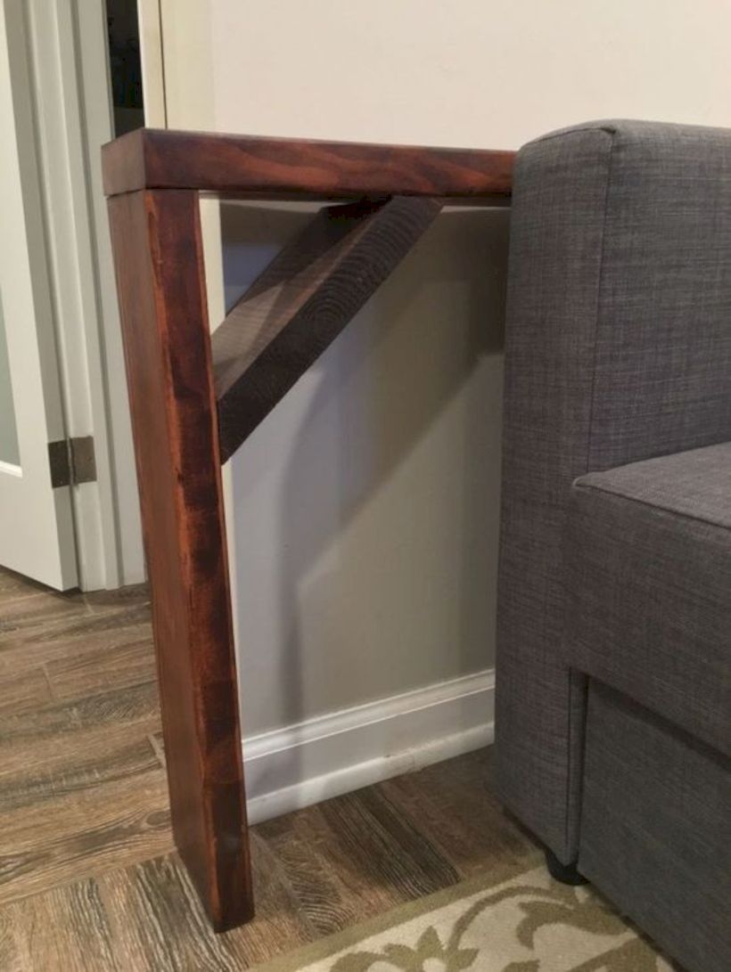 Behind the sofa table shelf