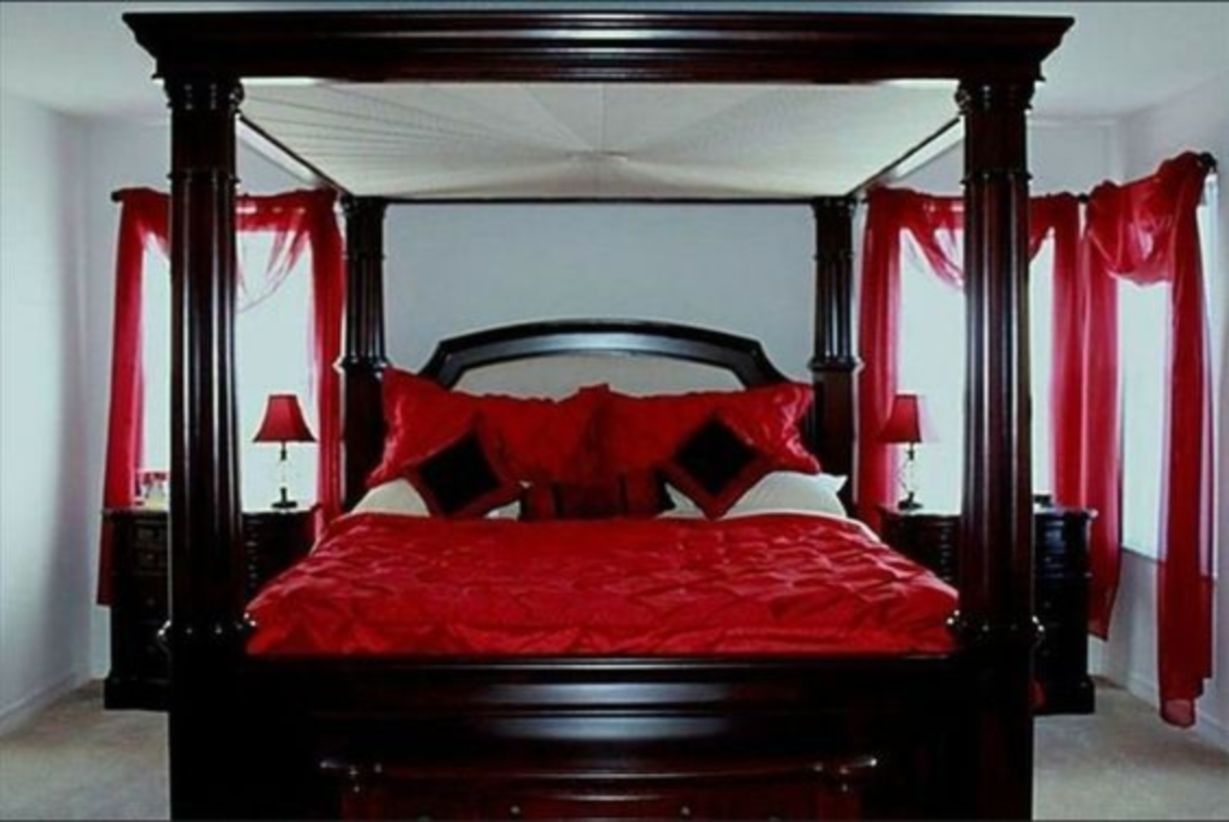 Romantic king size bed with red bedding