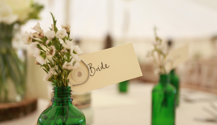 Table sign with greenery