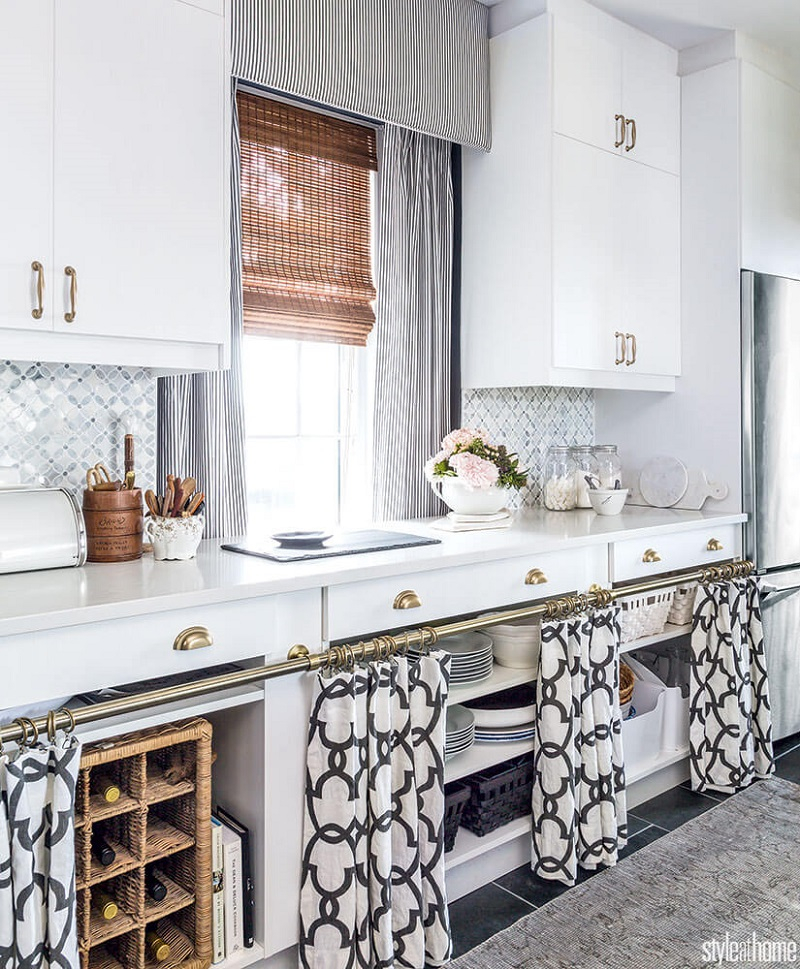 Modern black-and-white quatrefoil curtains on brass rod