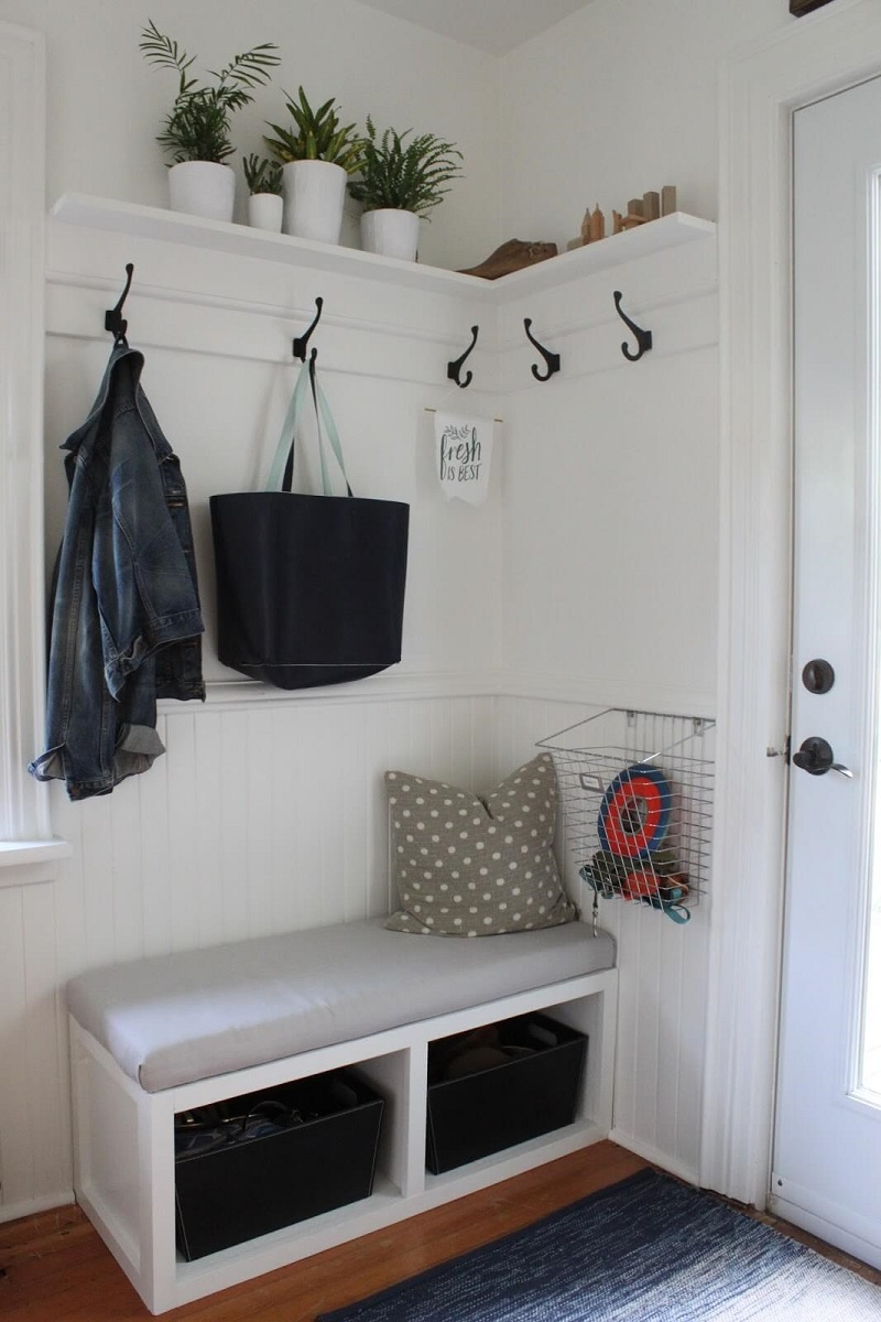 Storage bench with wall hooks