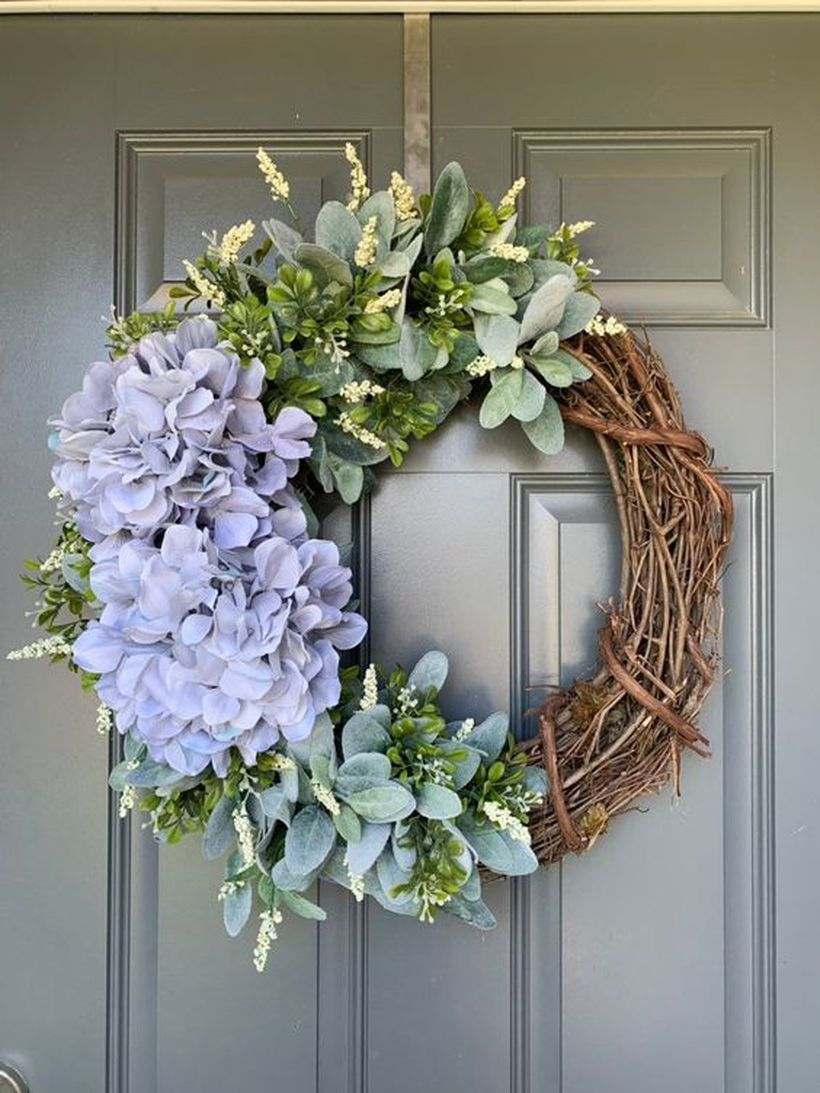 A Stunning natural ornament elements for the summer with starburst bouquets made of twigs old to decorate the door