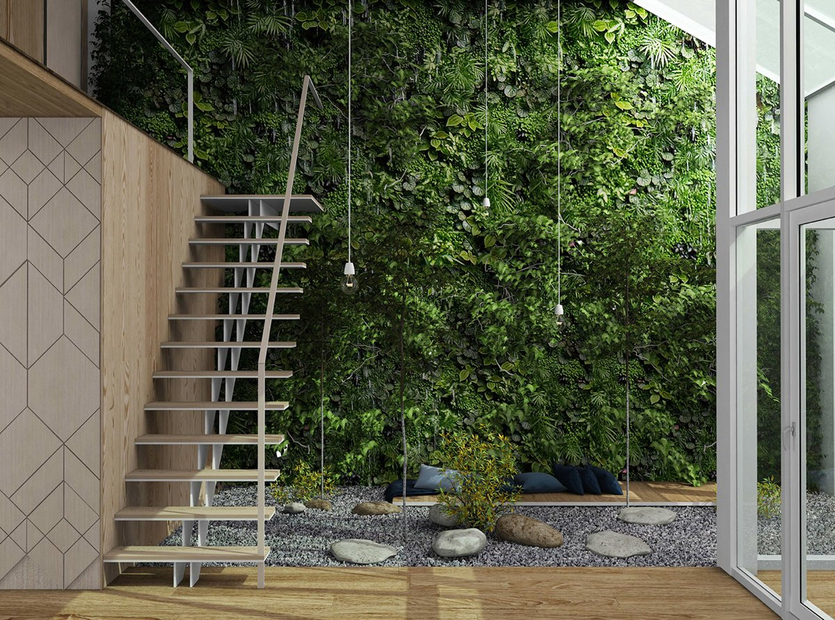 A lush vertical garden reaches to the heights of the atrium and is easy to appreciate from the mezzanine level above to create warm impresion