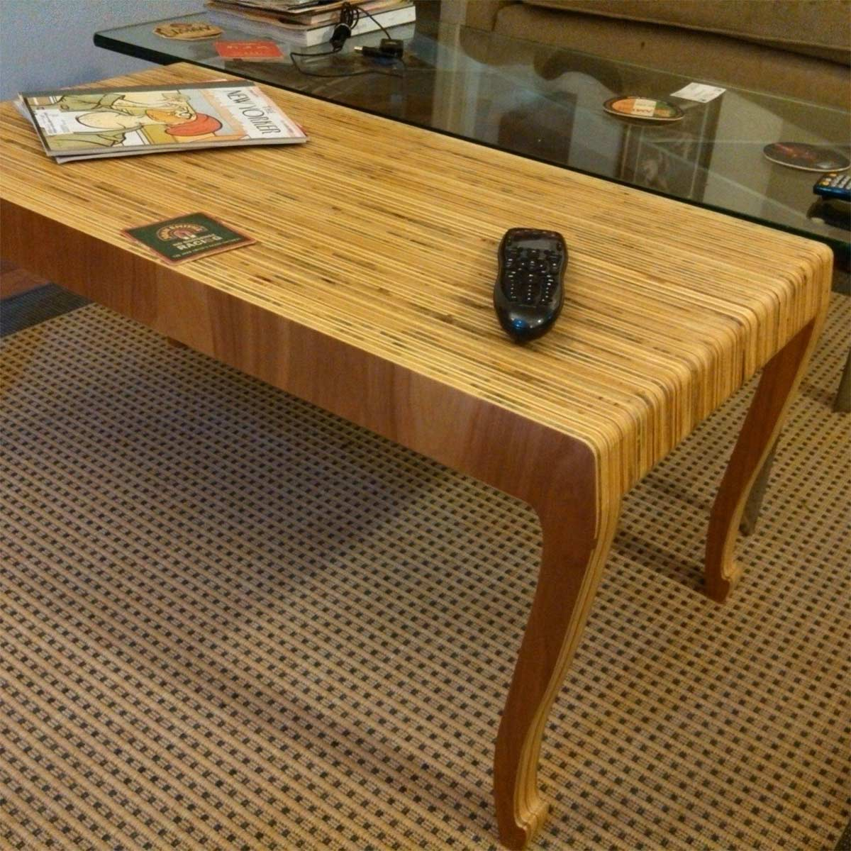 A stylish table made of plywood furniture that forms a graceful curve