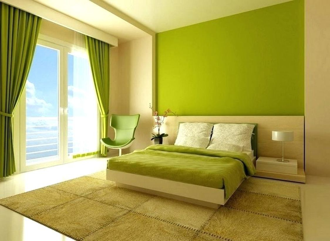 An amazing green bedrooms with a green wall, green curtains, green chairs, a brown carpets, a large windows that make the rooms bright