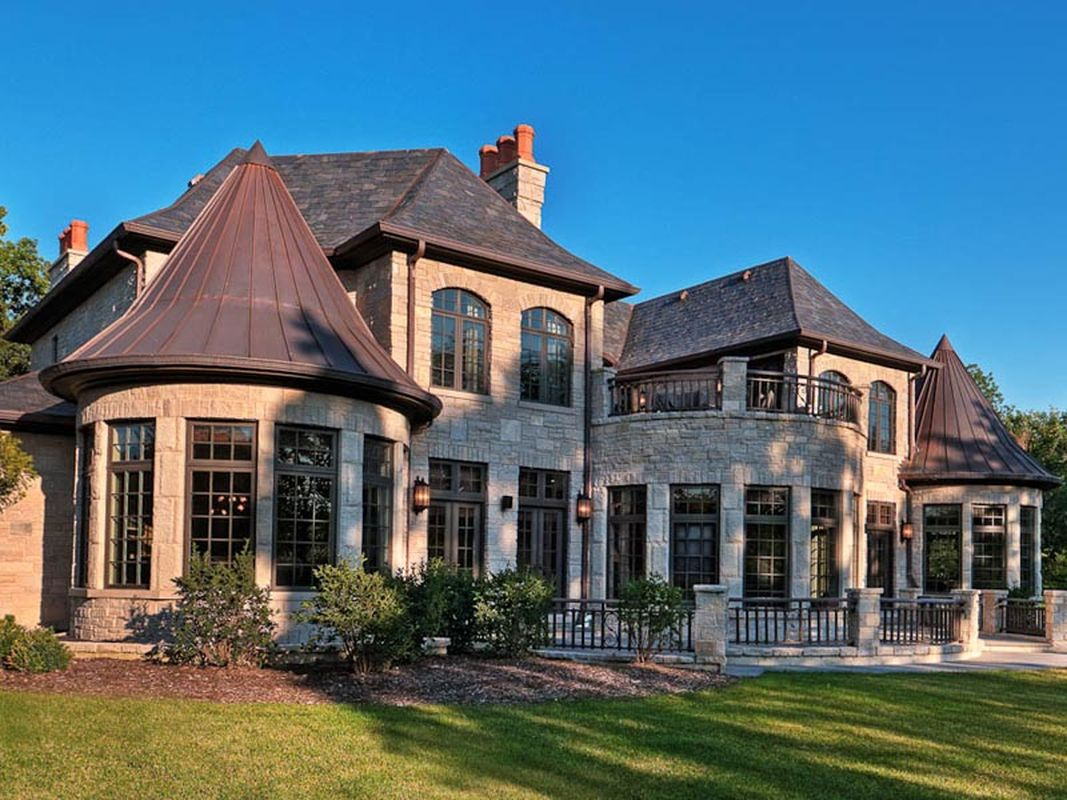 An amazing classic exterior with light grey stone walls, dark roof and classic window to perfect your classic home