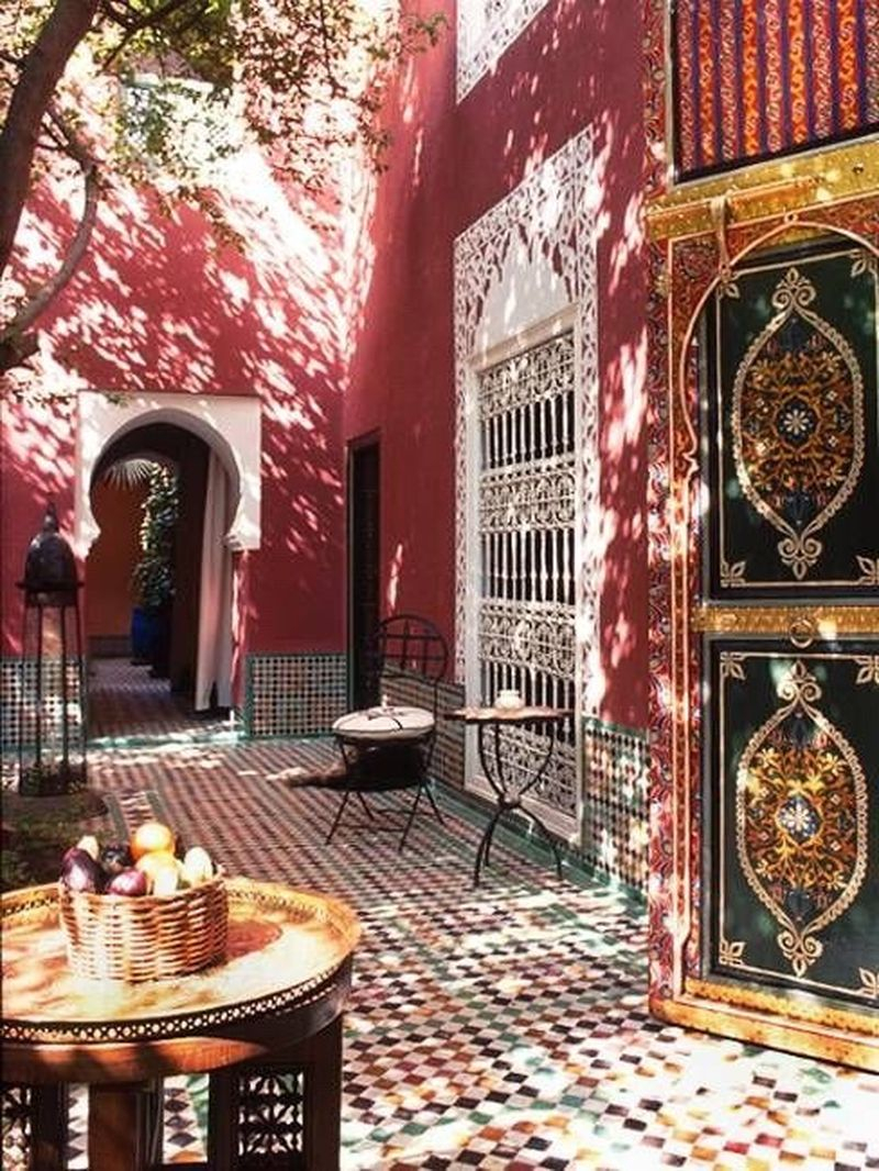 An amazing exterior design with brown walls, mosaic floor design, unique door design to perfect your boho home design