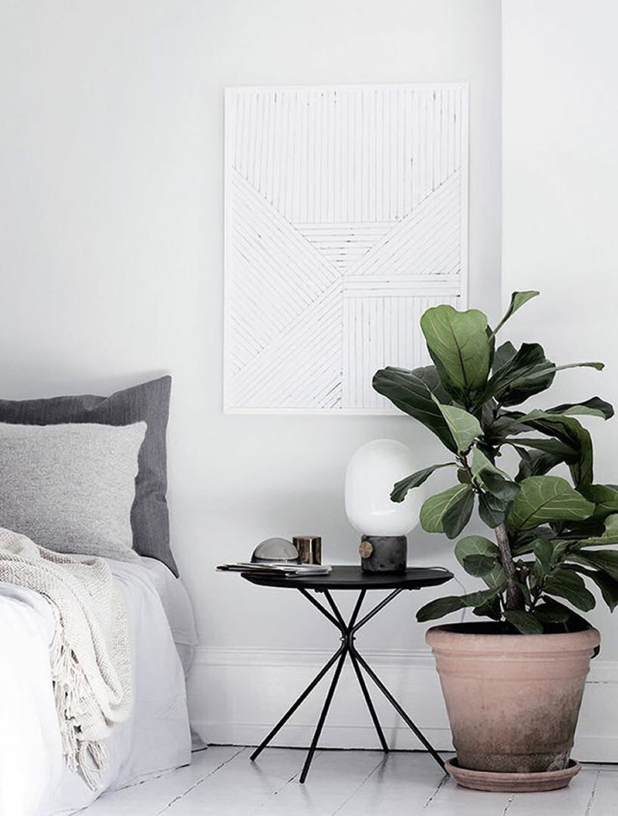 An elegant bedroom decor with big greenery to add freshness to your room