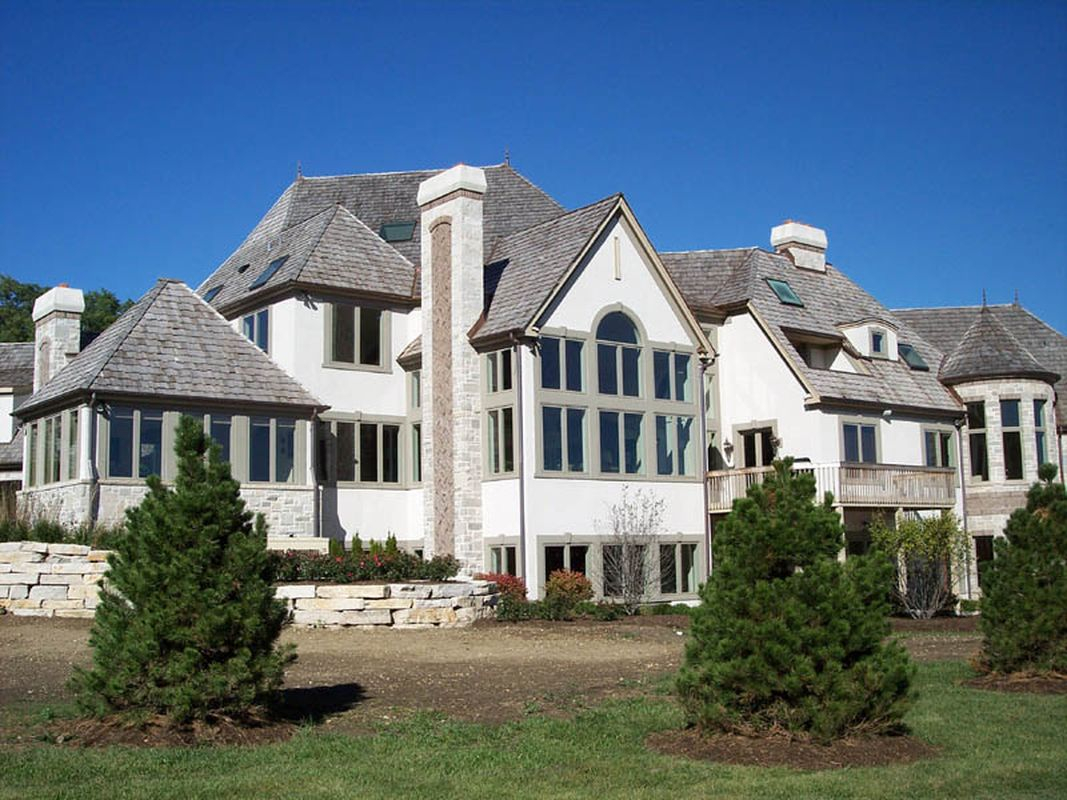 Beautiful classic exterior design with white walls, light grey roof and light grey windows to perfect your classic home