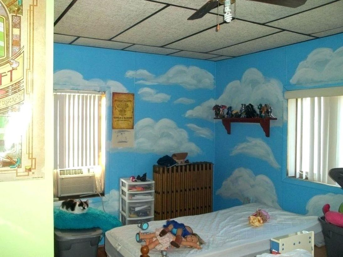 Beautiful blue children's room and white cloud motif with white windows, white curtains, white bedding