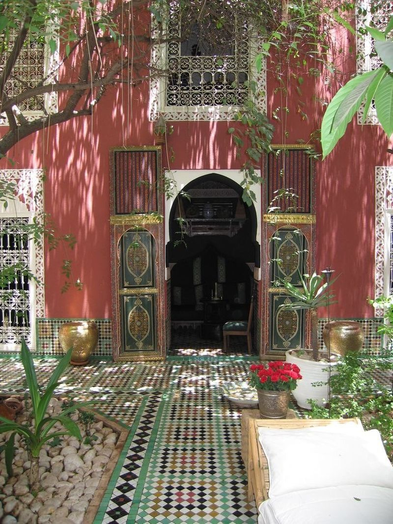 Boho exterior design with brown walls, mosaic floor for front yard and vines to beautify your home