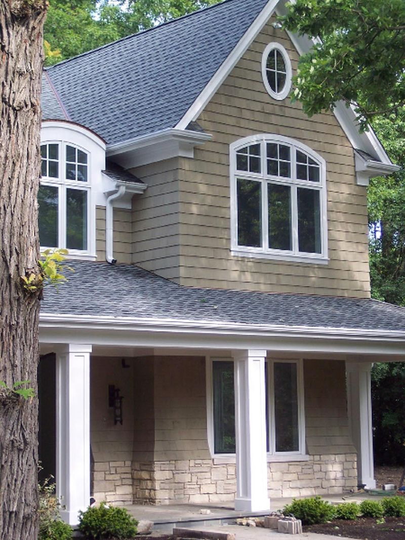 Classic exterior design with grey walls, light grey roof and white windows to decorate your classic home