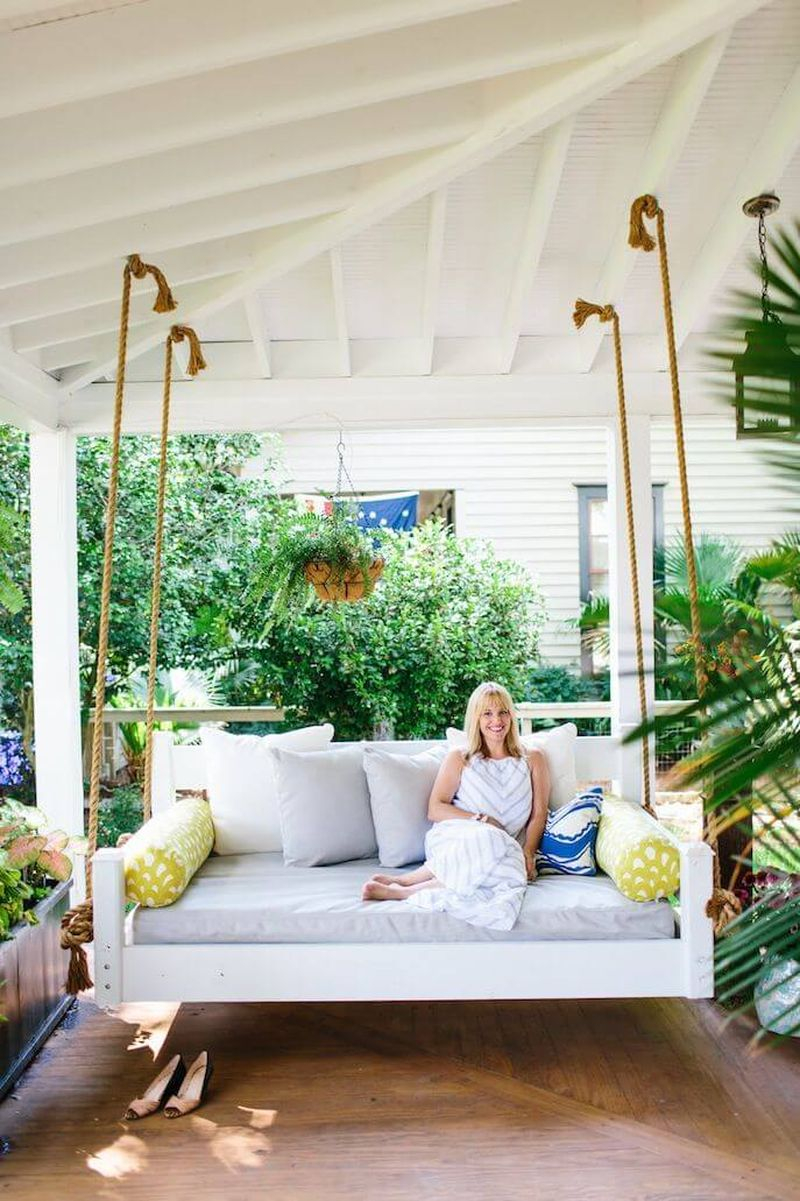 Diy outdoor furniture projects with a hanging daybed sofa to complete your backyard