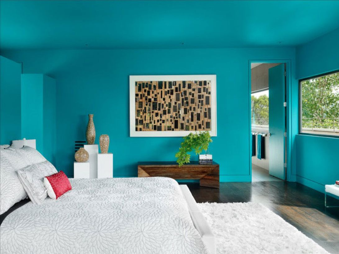 Simple blue bedroom ideas with blue walls, a white bed, white carpet, wooden floors that make the room comfortable