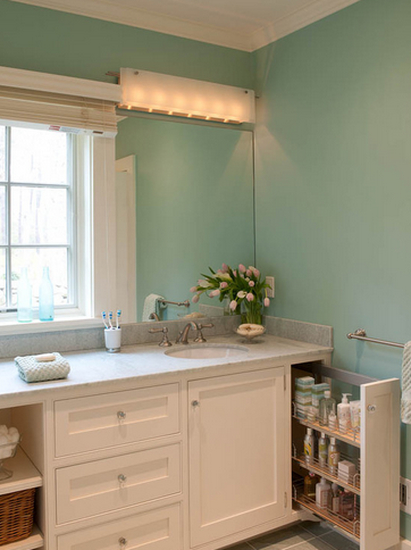 A creative bathroom storage ideas with hidden storage to store toiletries, a sink, and a window to create good lighting