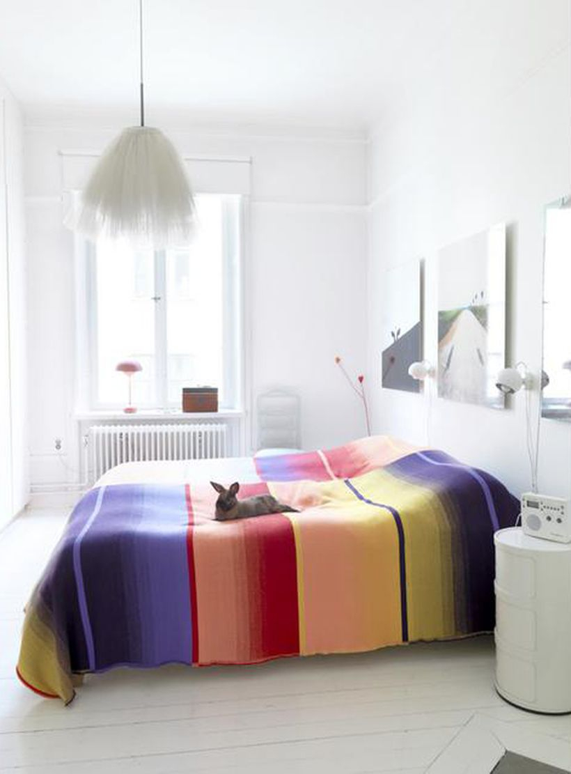 Awesome beds with splashes of color blankets, white beds, white walls, white floors for easy design rooms