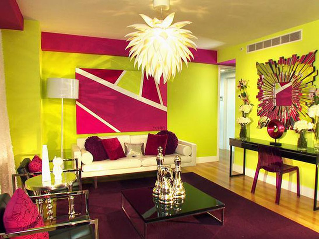 Stunning beautiful living room with splashes of yellow and purple pillows, purple, black square tables, wooden floors to create pleasurable