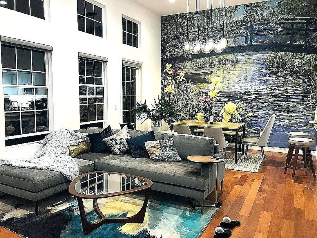 Wonderful living and dining room with splash-color motifs of beautiful blue walls, splash carpet color, wooden floor to create cozy