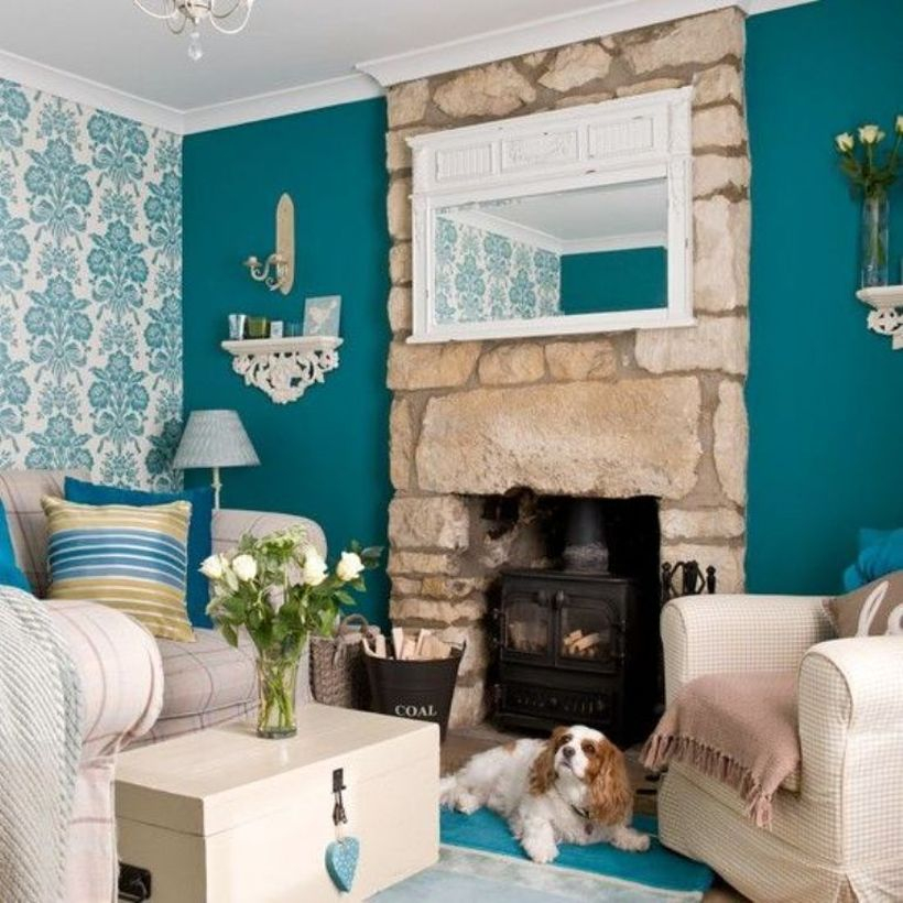 A comfortable home paint colors with green tosca on one of the living room walls that you have can you combine with light blue patterned wallpaper