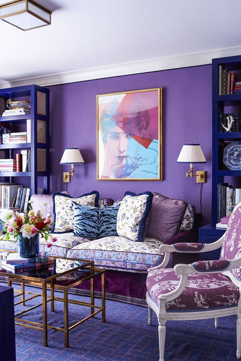 A wonderful home paint colors with mauve walls,velvet coated special sofa, a large carpet and table gold