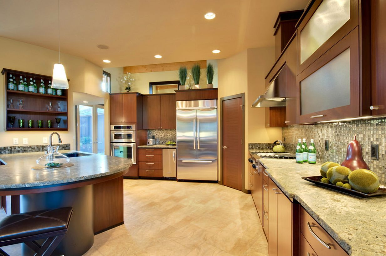 An attractive home paint colors with the room is surrounded by beige walls and lighted by recessed and pendant lights