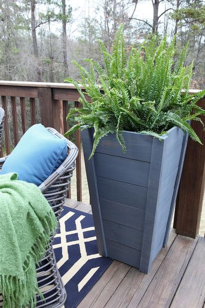 An awesome diy painted wood tall planter with blue paint to perfect your outdoor decoration