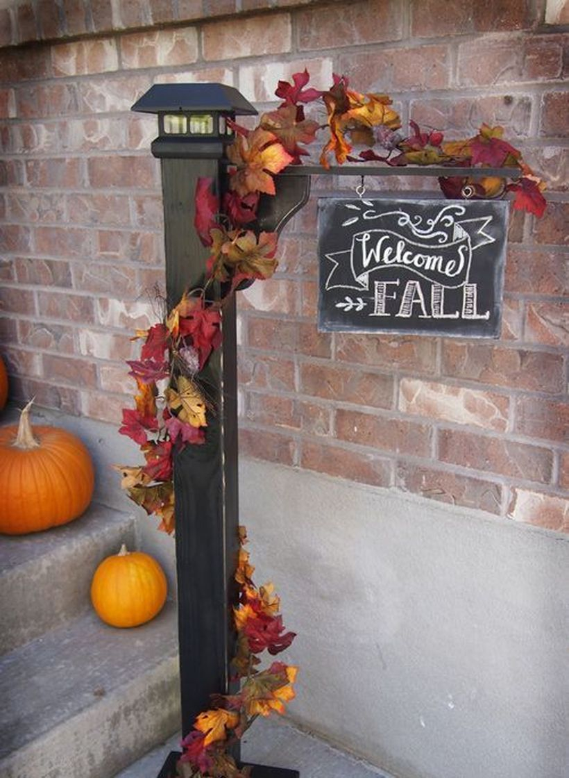 Beautiful porch ideas with hanging wooden fall welcome signs and small pumpkins