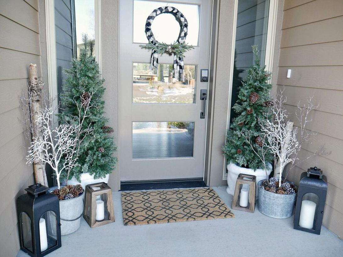 Best farmhouse porch ornament with plants in white pots, wooden candle lights to complete your front yard