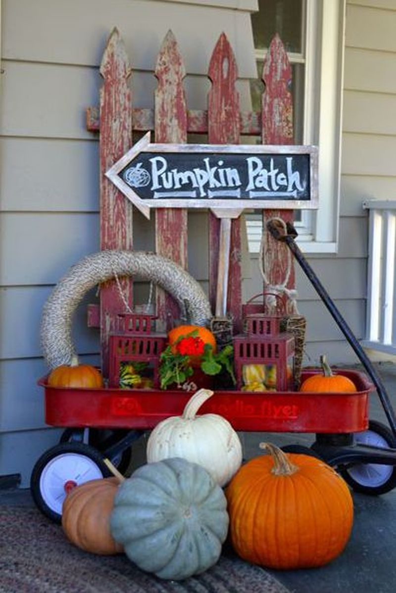 Cute fall decoration display using a repurposed little red wagon with room for tons of pumpkins, gourds, and antique finds