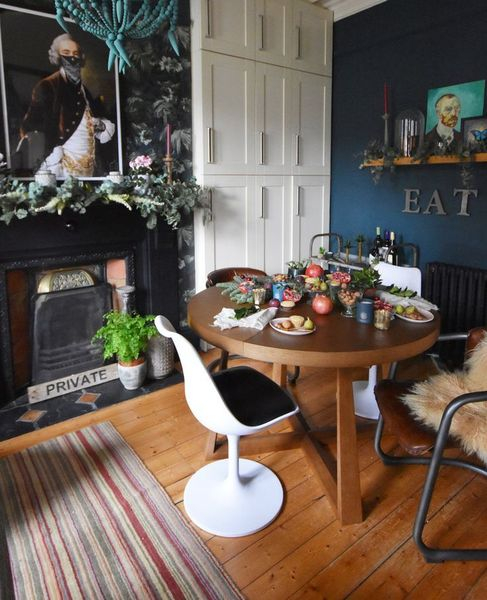 Dark blue walls combined with wooden floor
