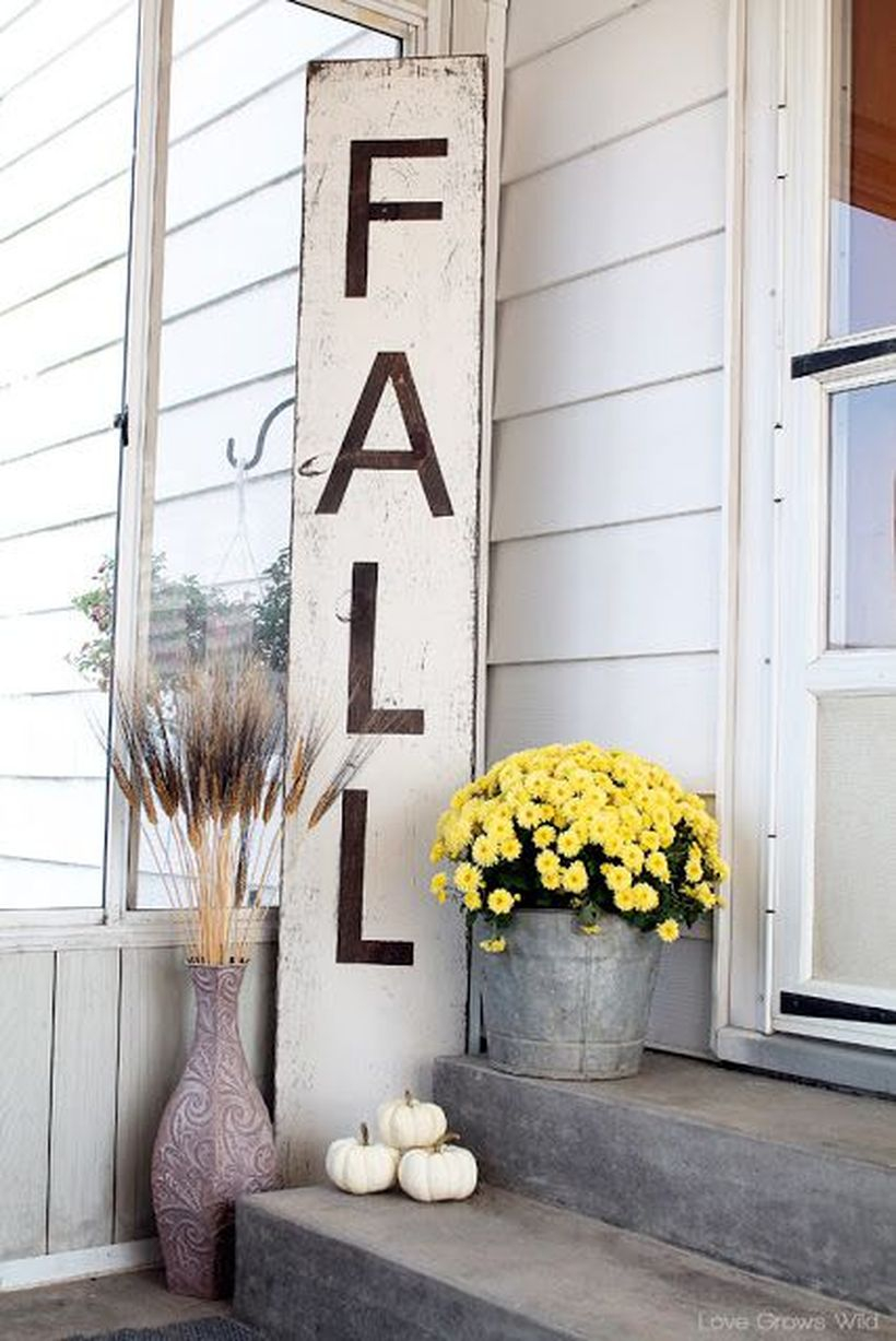 Interesting porch ideas fall welcome signs with white wooden slats, white pumpkin, yellow flower and reed plant
