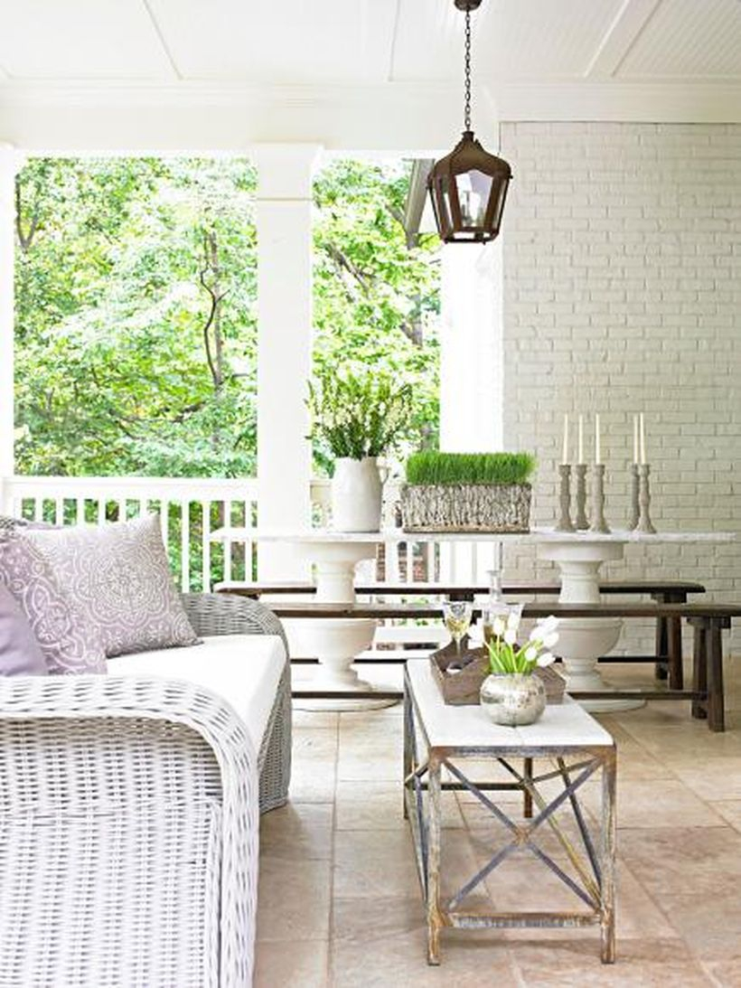 Interesting seating ideas with white rattan chair, white seat cushion and square wooden tables