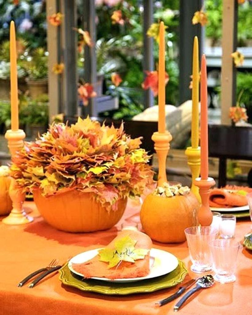 Orange pumpkin and dried leaves centrepiece ideas