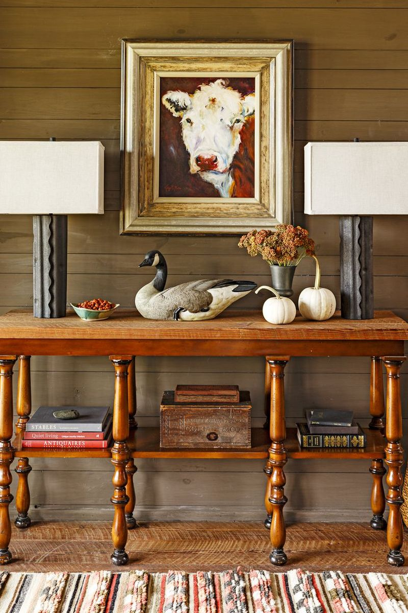 Place two small white pumpkins on an entryway table to greet guests in this fall season