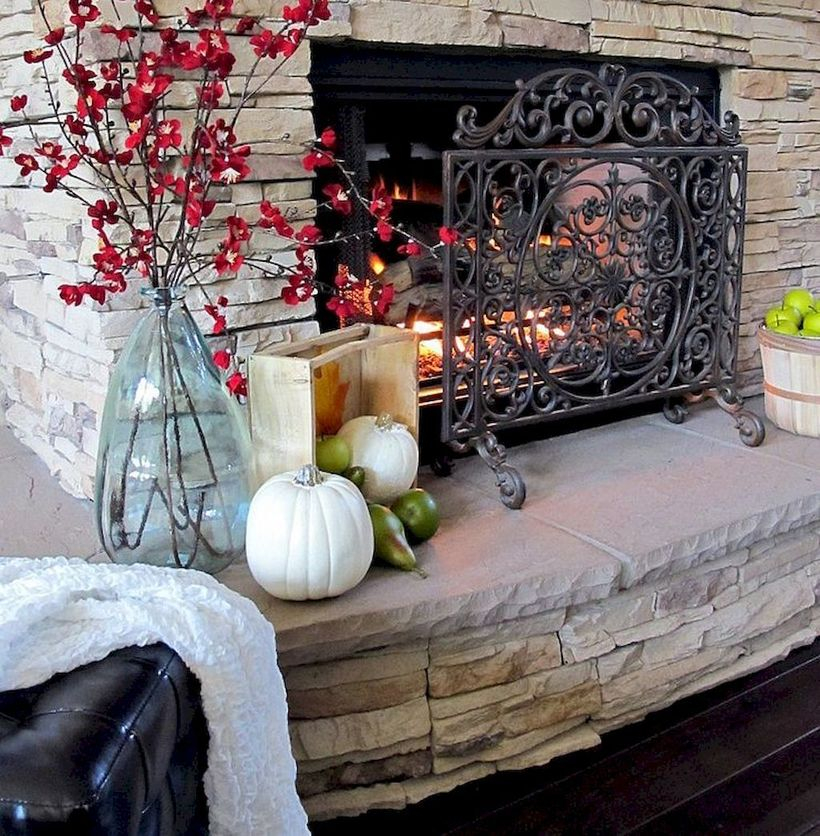 Red flowers and pumpkin fireplace decoration ideas