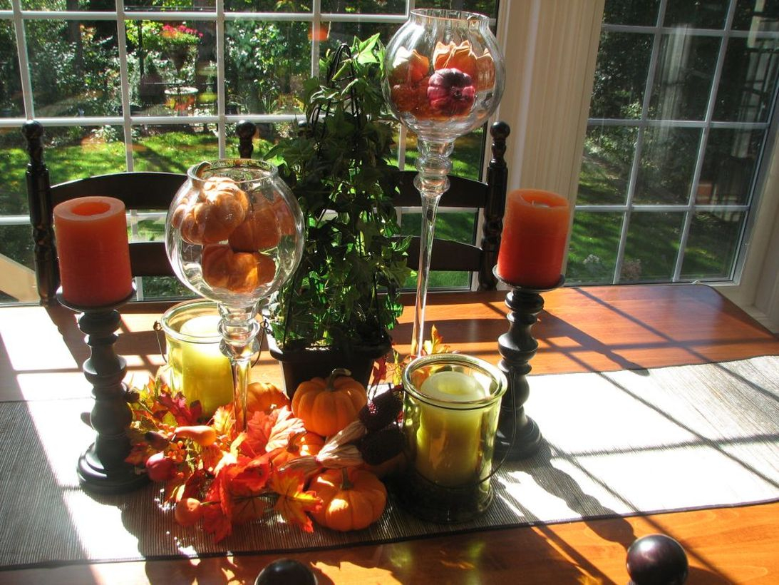 Small orange pumpkin and candle light centrepiece ideas