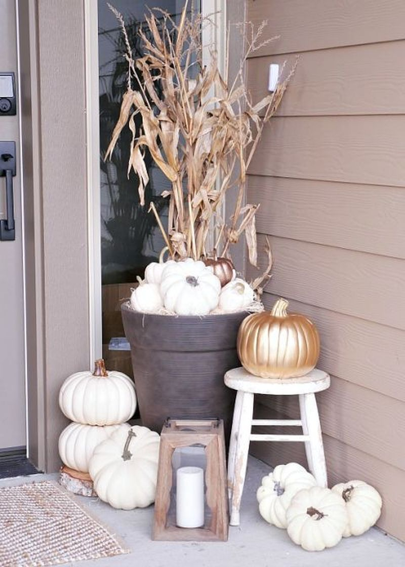 Use spray paint to coat pumpkins in white or metallic gold for a modern but simple scheme to complete your fall decoration