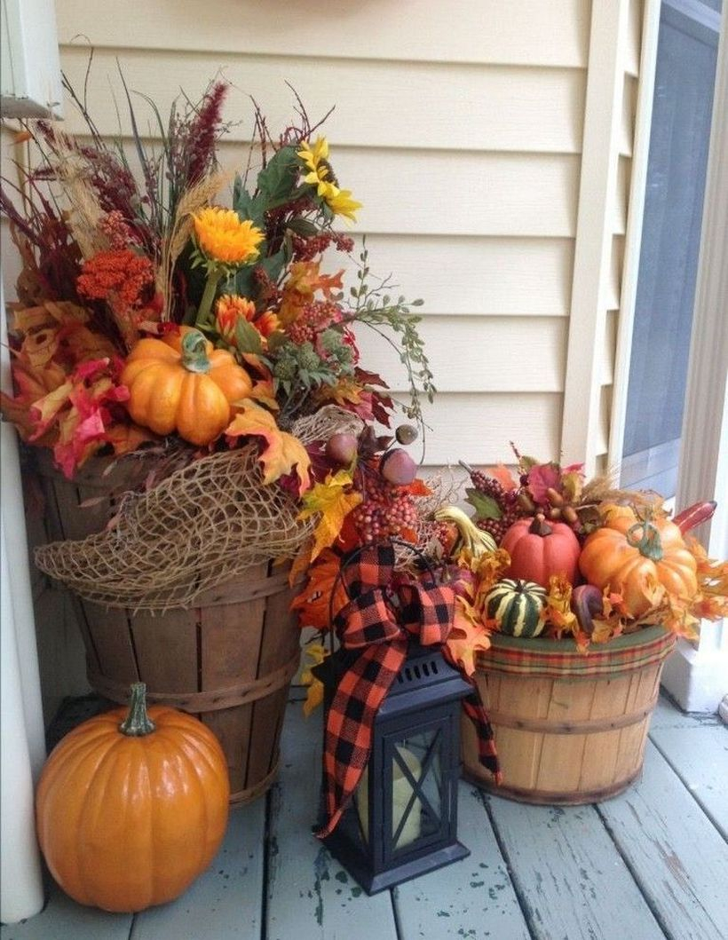 Flower arrangement using pumpkins and wood crates