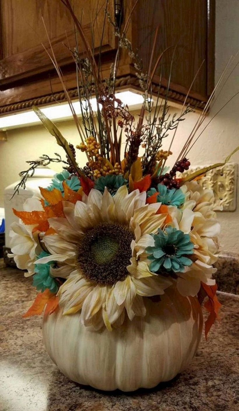 Flower arrangement using white pumpkins
