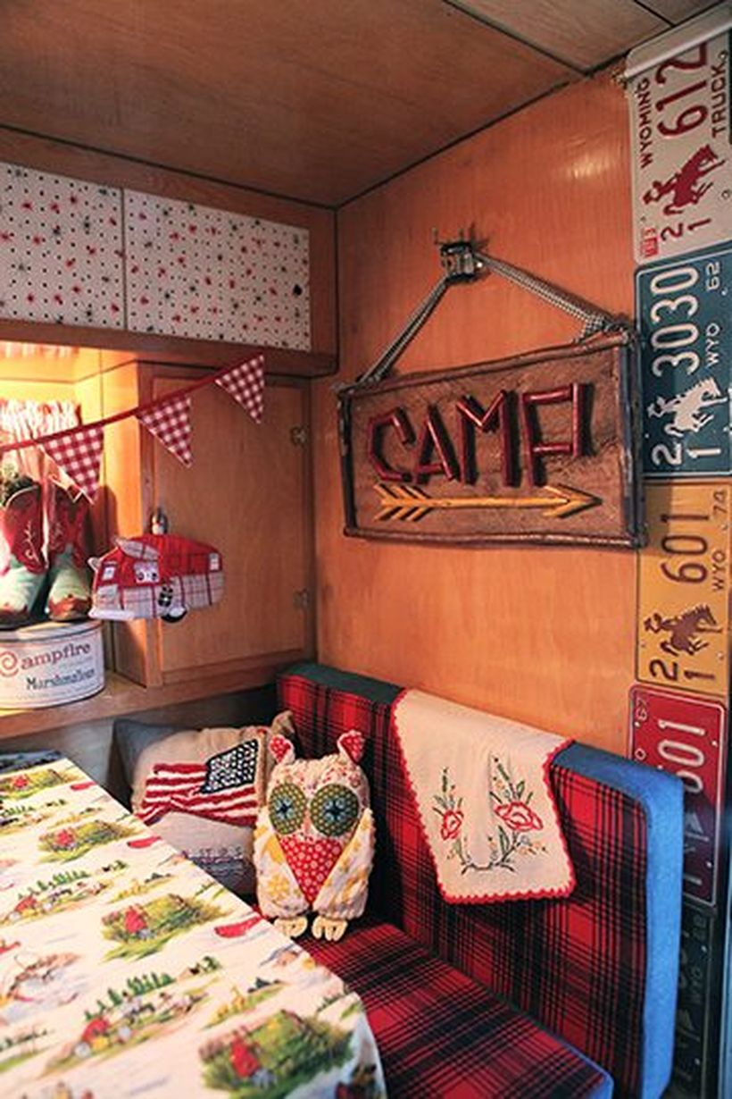 Rustic rv decoration ideas with wooden hanging ornament colorful triangle flag and same plates
