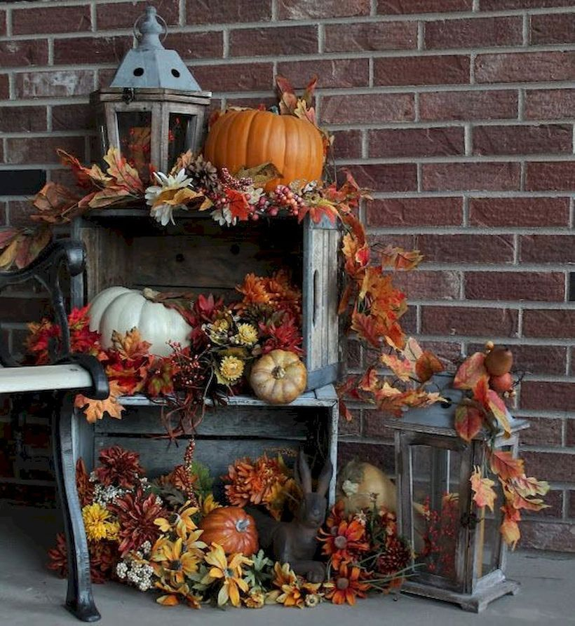 White and orange pumpkins and wooden box