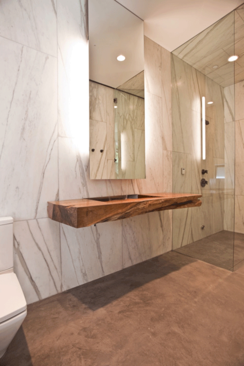 Nice and minimalist bathroom with the glass wall with a concrete 05