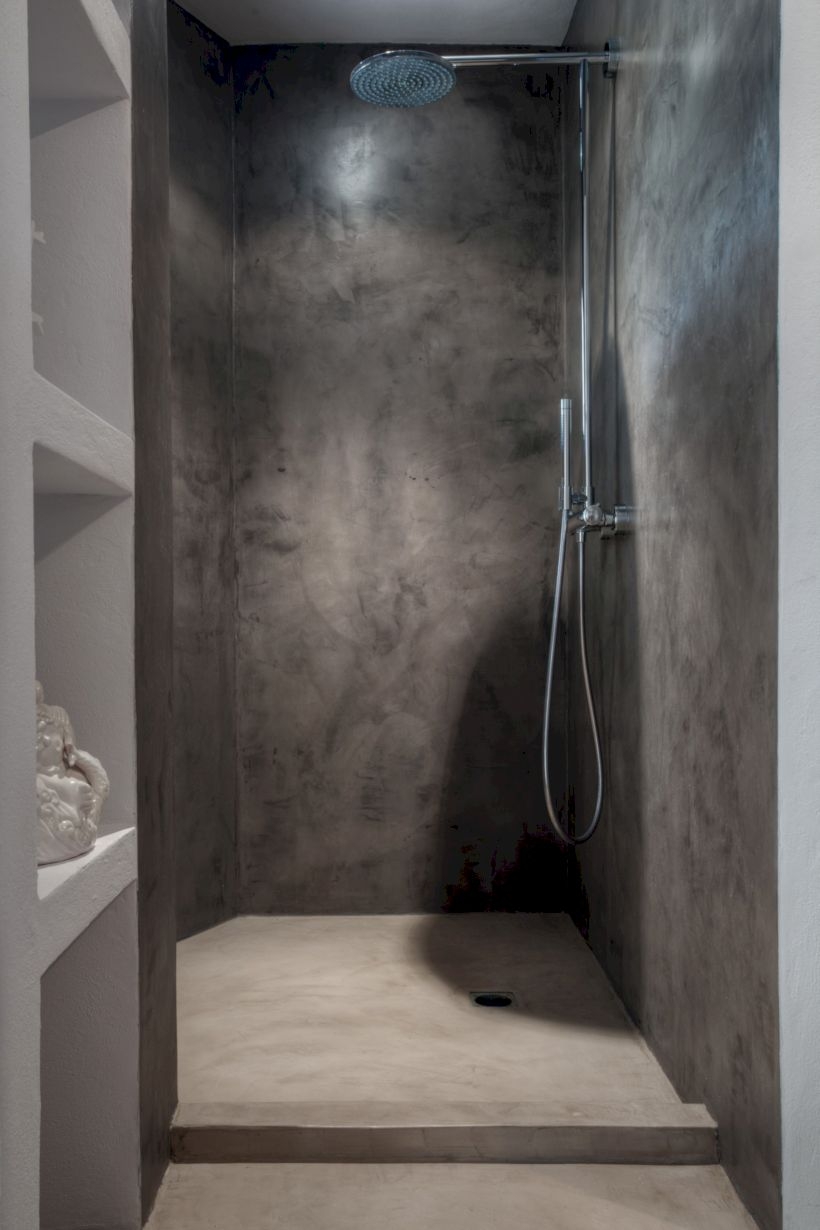 Nice and minimalist bathroom with the glass wall with a concrete 06