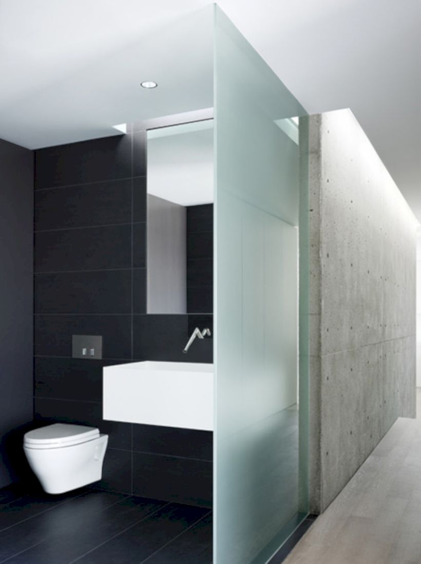 Nice and minimalist bathroom with the glass wall with a concrete 08